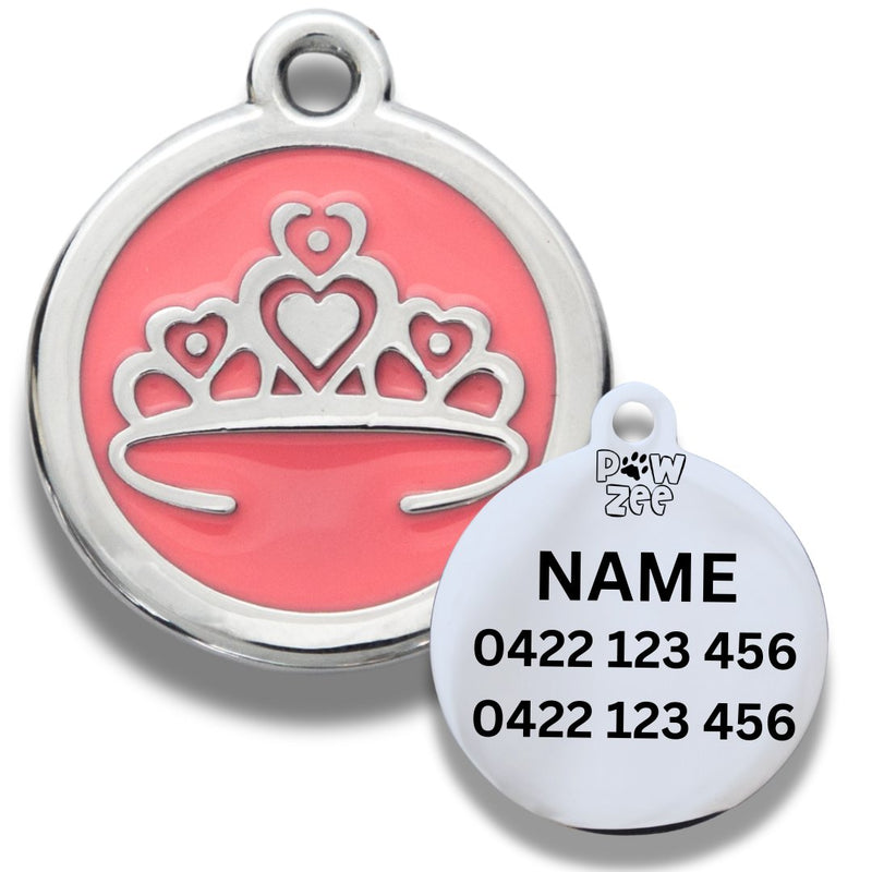 A pink tiara-shaped pet ID tag with a silver border and a sample name and phone number engraved on it.