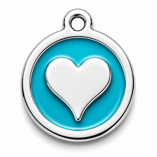 Silver dog tag  with a heart design on a blue background