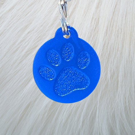 Bright blue PAWZO PET TAGS 2 FOR $28 - LARGE featuring a big paw print, perfect for dogs and cats. Free delivery Australia wide!