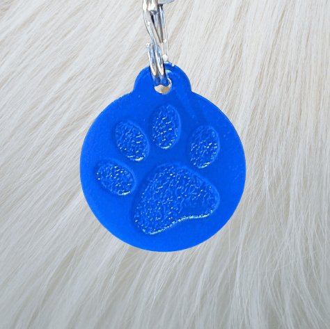 Paw personalised dog name tag in blue aluminium with engraved pet name and phone number